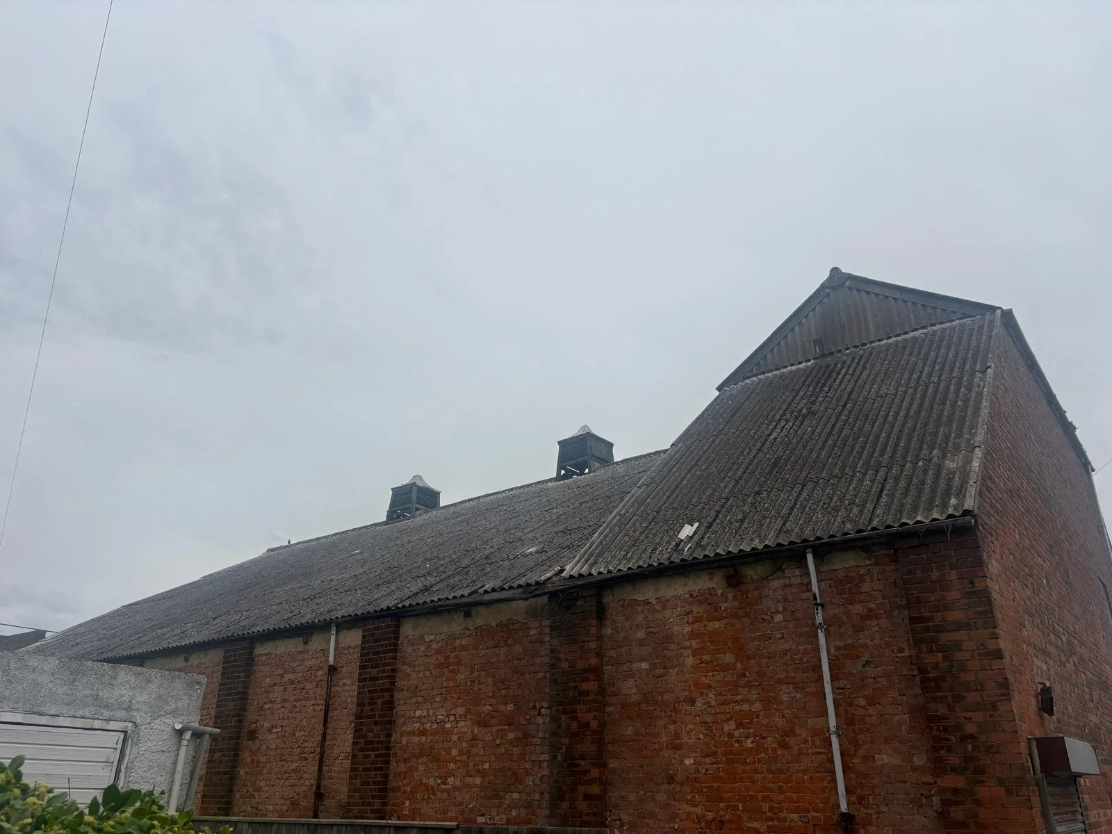 Large corrugated commercial roof shown as asbestos roof removal context in Teesside